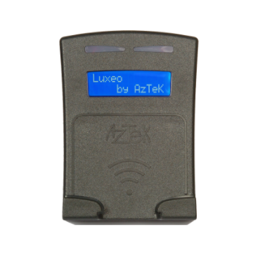 The Aztek media reader is rectangular in shape and gray in color. It has two small feet at the bottom to support the cards, and a blue screen at the top.